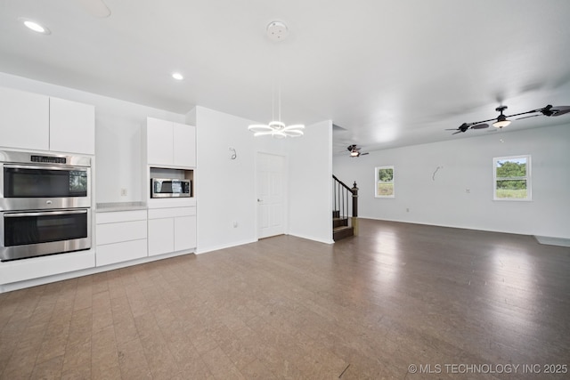4127 New Prue Rd, Sand Springs, OK 74063 - kitchen with stainless steel appliances, open floor plan, ceiling fan, white cabinetry, and wood finished floors