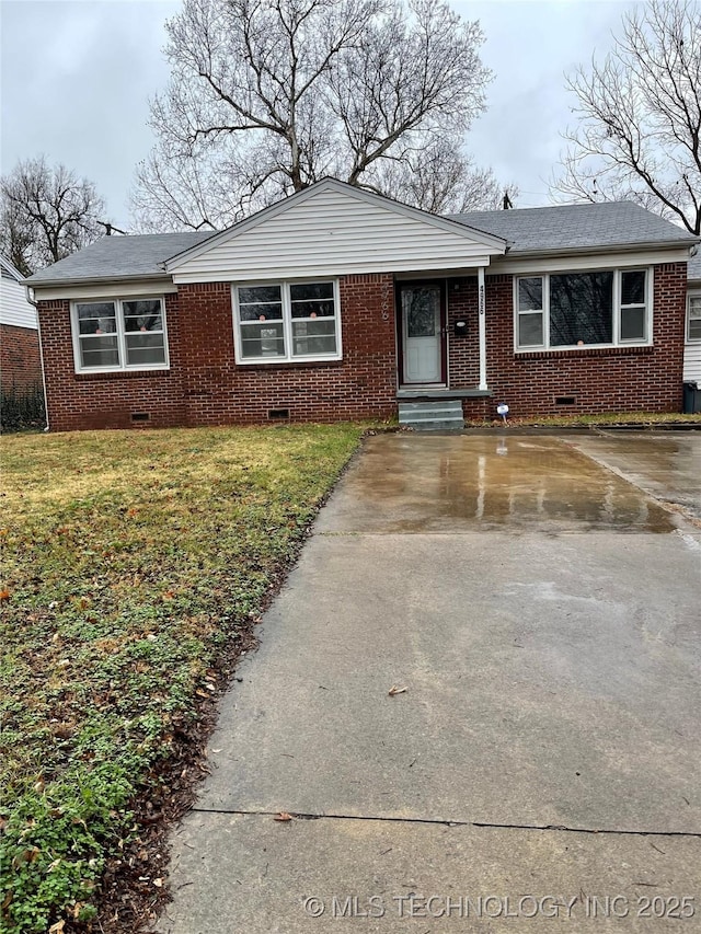 4966 S Madison Ave, Tulsa, OK 74105 - view of front of house featuring crawl space, brick siding, driveway, and a front yard