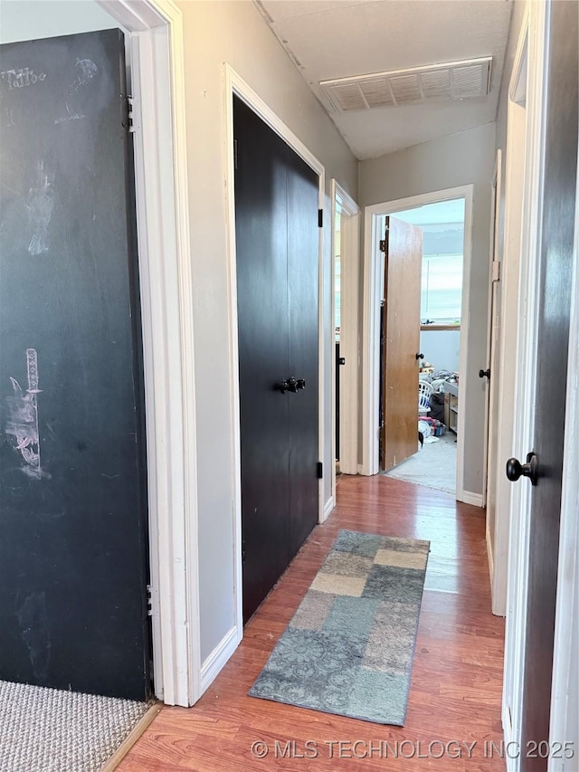 4822 S Bermuda Ave, Sand Springs, OK 74063 - hallway with wood finished floors and baseboards