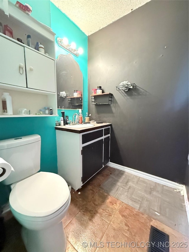 4822 S Bermuda Ave, Sand Springs, OK 74063 - bathroom with toilet and vanity