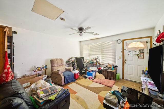1012 N Irvington St, Tulsa, OK 74115 - living room featuring ceiling fan and wood finished floors