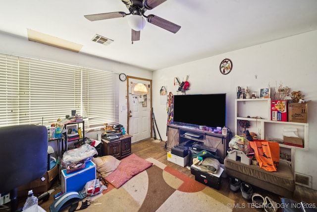1012 N Irvington St, Tulsa, OK 74115 - home office featuring ceiling fan and wood finished floors