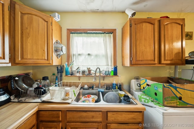 1012 N Irvington St, Tulsa, OK 74115 - kitchen with light countertops and brown cabinetry