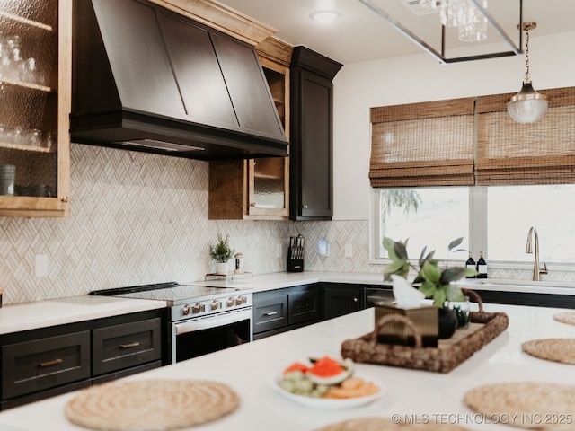 118900 S 4213, Eufaula, OK 74432 - kitchen with range hood, electric stove, light countertops, and decorative light fixtures