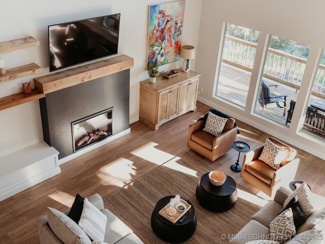 118900 S 4213, Eufaula, OK 74432 - living area featuring light wood-style floors and a fireplace