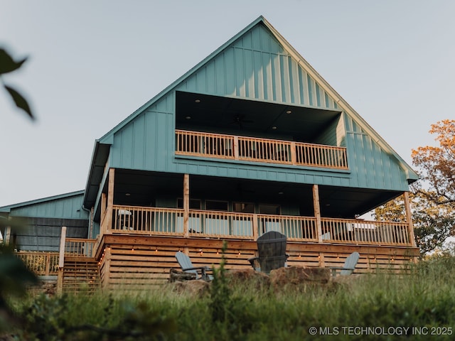 118900 S 4213, Eufaula, OK 74432 - view of front facade featuring board and batten siding and a balcony