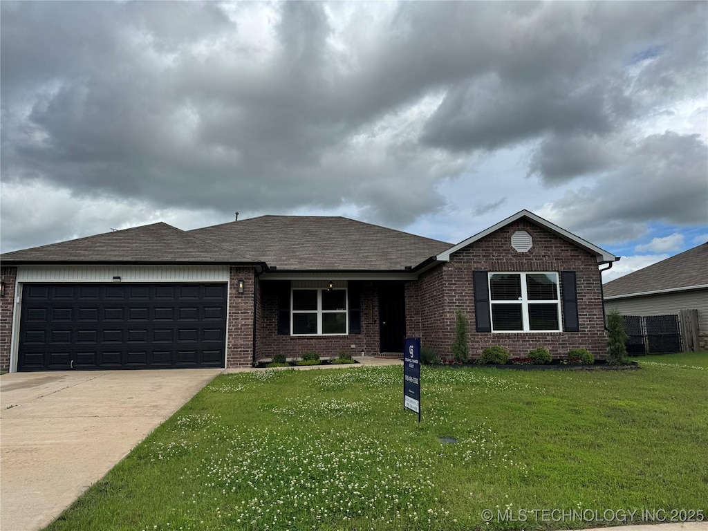 14911 S 274th E Ave, Coweta, OK 74429 - ranch-style house with brick siding, an attached garage, driveway, a front yard, and roof with shingles