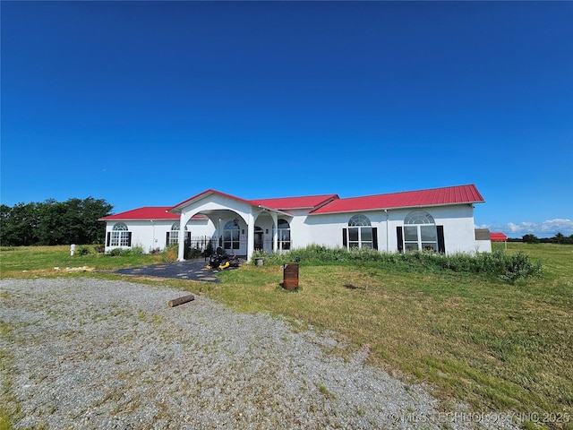 38032 State Road 78 W, Durant, OK 74701 - ranch-style home featuring stucco siding, a metal roof, and a front yard