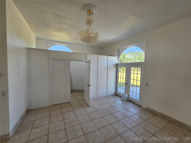 38032 State Road 78 W, Durant, OK 74701 - foyer featuring french doors, a chandelier, a textured ceiling, and crown molding