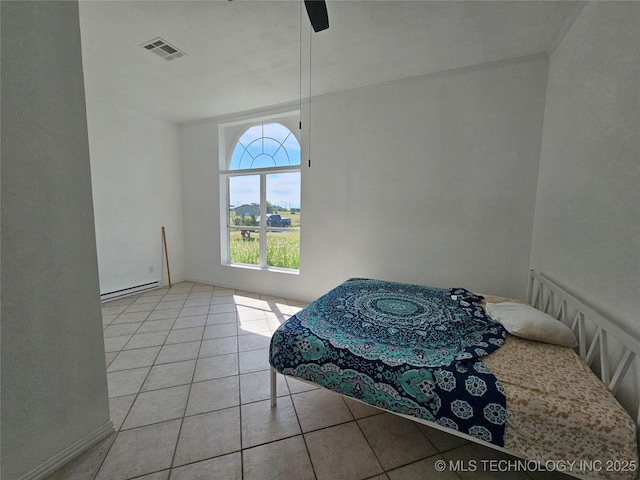 38032 State Road 78 W, Durant, OK 74701 - dining space featuring tile patterned floors, a ceiling fan, and a baseboard radiator