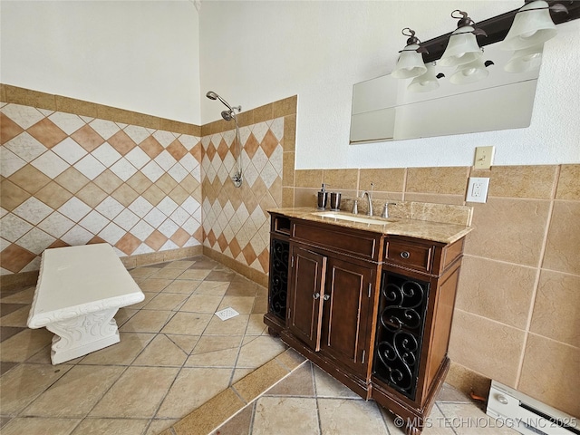 38032 State Road 78 W, Durant, OK 74701 - full bath featuring tile walls, tiled shower, vanity, and a wainscoted wall
