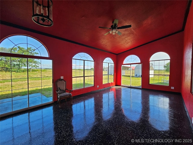 38032 State Road 78 W, Durant, OK 74701 - unfurnished room featuring a ceiling fan, vaulted ceiling, crown molding, and speckle patterned floor