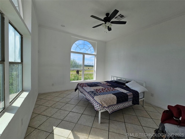 38032 State Road 78 W, Durant, OK 74701 - bedroom featuring multiple windows, light tile patterned floors, and a ceiling fan