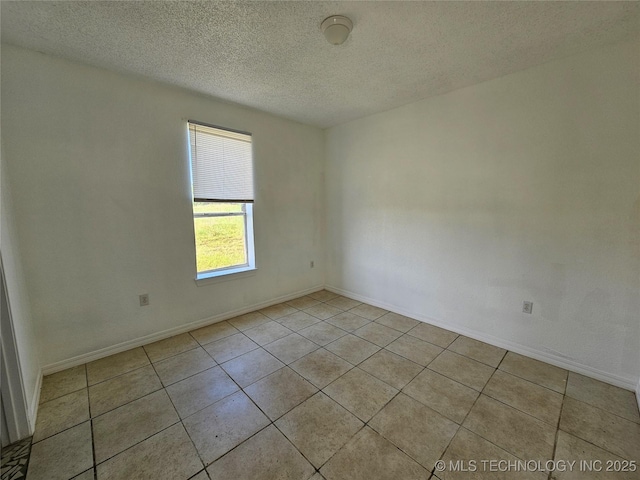 38032 State Road 78 W, Durant, OK 74701 - spare room with a textured ceiling and tile patterned floors