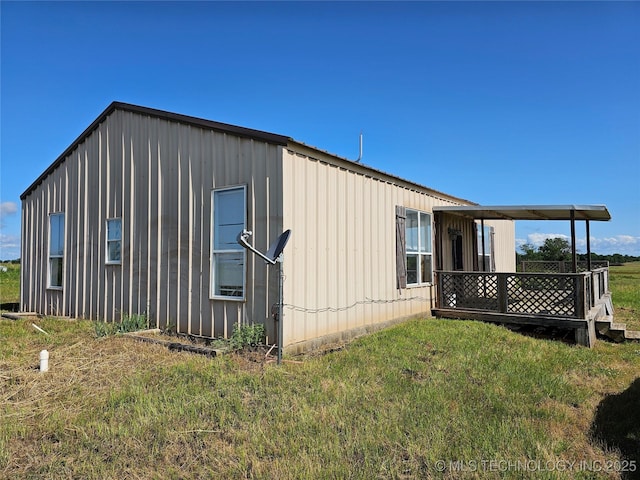 38032 State Road 78 W, Durant, OK 74701 - view of side of property featuring a lawn and board and batten siding