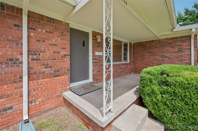 2178 S 76th E Ave, Tulsa, OK 74129 - entrance to property featuring covered porch and brick siding