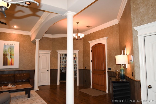 2463 S Park Hl, Tahlequah, OK 74464 - entryway featuring decorative columns, wood finished floors, a wainscoted wall, crown molding, and a chandelier