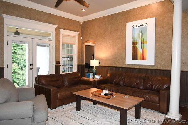 2463 S Park Hl, Tahlequah, OK 74464 - living room with a ceiling fan, ornamental molding, wood finished floors, a wainscoted wall, and ornate columns