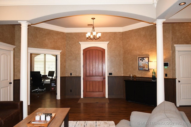 2463 S Park Hl, Tahlequah, OK 74464 - entryway featuring wood finished floors, arched walkways, wainscoting, ornamental molding, and a chandelier