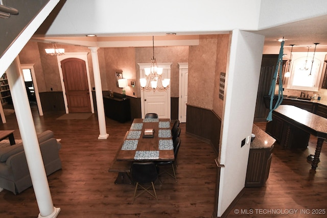 2463 S Park Hl, Tahlequah, OK 74464 - dining room featuring a chandelier, wood finished floors, and ornate columns