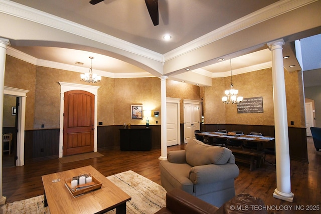 2463 S Park Hl, Tahlequah, OK 74464 - living room with a chandelier, ceiling fan, ornate columns, wood finished floors, and crown molding
