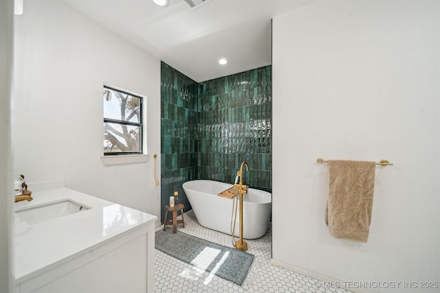 7482 N 439, Adair, OK 74330 - full bath featuring a soaking tub, vanity, recessed lighting, tile walls, and a tile shower