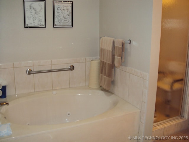 8303 E 77th Pl, Tulsa, OK 74133 - bathroom featuring a stall shower and a whirlpool tub