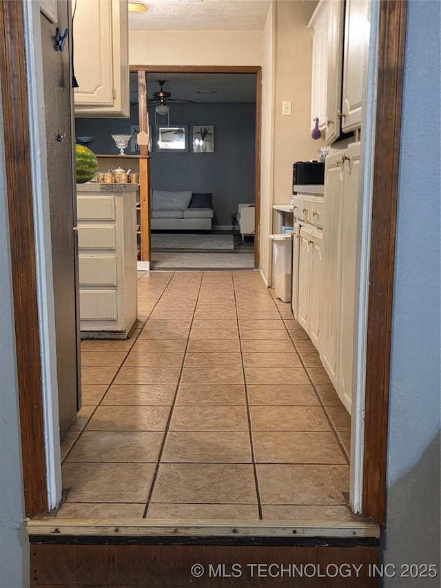 14177 E 590th Rd S, Inola, OK 74036 - corridor featuring light tile patterned floors