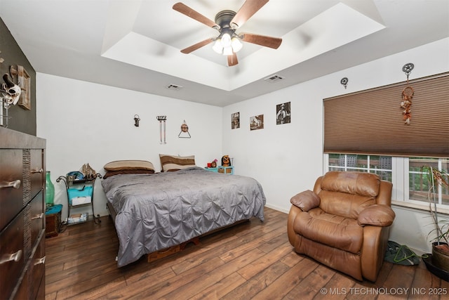 30103 S 4210th Rd, Inola, OK 74036 - bedroom featuring a raised ceiling, wood-type flooring, and a ceiling fan