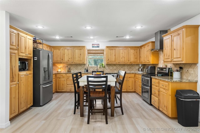 110094 S 4680th Rd, Gans, OK 74936 - kitchen with appliances with stainless steel finishes, wall chimney exhaust hood, light stone counters, light wood-type flooring, and recessed lighting