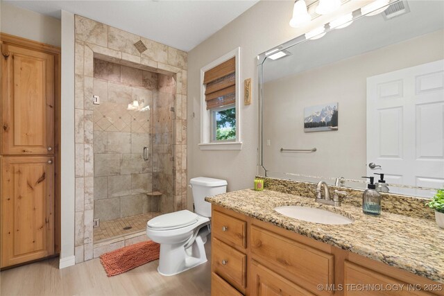 110094 S 4680th Rd, Gans, OK 74936 - bathroom featuring vanity, a shower stall, and wood finished floors