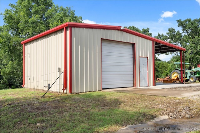110094 S 4680th Rd, Gans, OK 74936 - garage featuring a garage and driveway