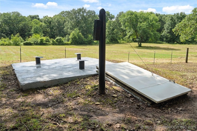 110094 S 4680th Rd, Gans, OK 74936 - entry to storm shelter featuring a forest view