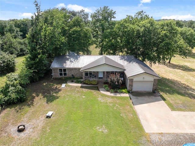 110094 S 4680th Rd, Gans, OK 74936 - view of front facade with driveway, a garage, a metal roof, and brick siding