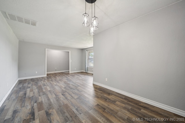 2331 S 99th E Ave, Tulsa, OK 74129 - empty room with dark wood finished floors and baseboards