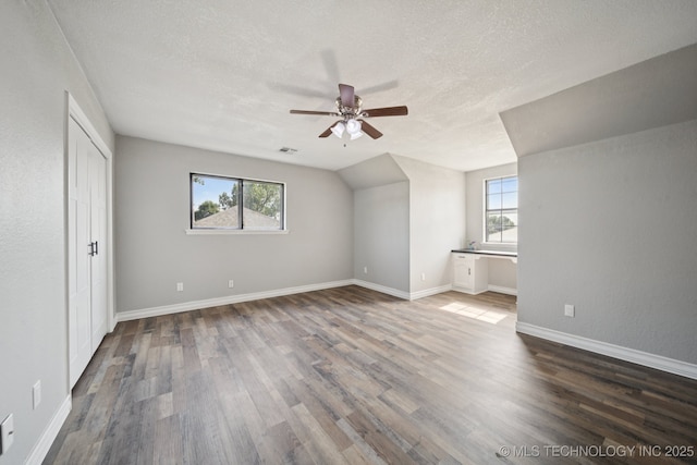 2331 S 99th E Ave, Tulsa, OK 74129 - additional living space featuring ceiling fan, a textured ceiling, and wood finished floors