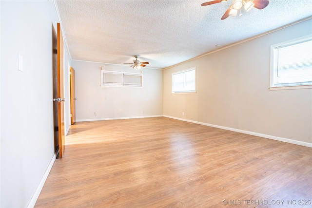 6781 E 26th Pl, Tulsa, OK 74129 - unfurnished room with ceiling fan, a textured ceiling, ornamental molding, and light wood-style floors
