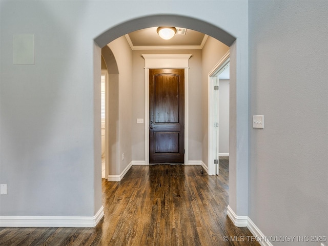 5815 E 144th St S, Bixby, OK 74008 - entrance foyer featuring dark wood-style floors, crown molding, and arched walkways