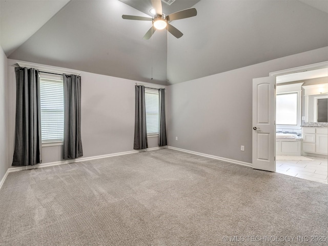 5815 E 144th St S, Bixby, OK 74008 - unfurnished bedroom with vaulted ceiling, light colored carpet, connected bathroom, and a ceiling fan