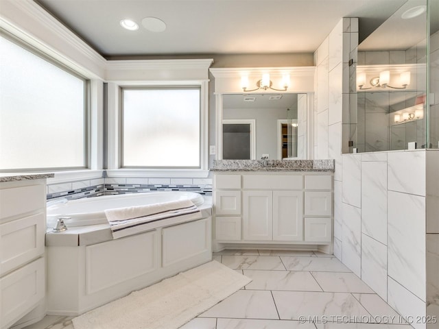 5815 E 144th St S, Bixby, OK 74008 - bathroom with marble finish flooring, vanity, a garden tub, and walk in shower