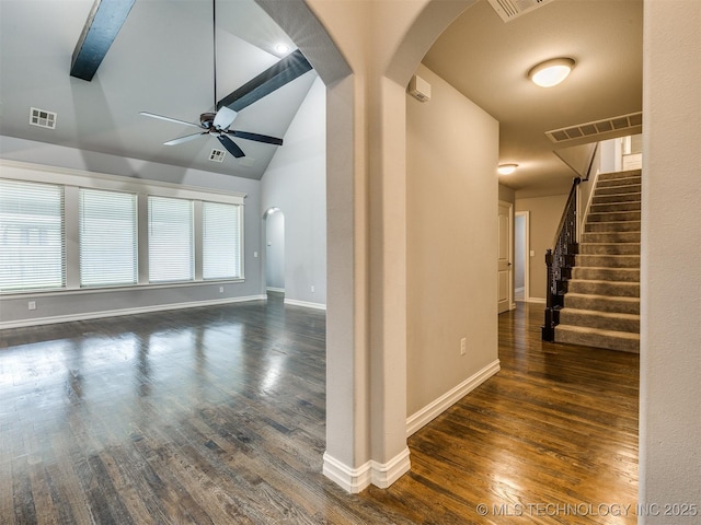 5815 E 144th St S, Bixby, OK 74008 - unfurnished living room with arched walkways, a ceiling fan, wood finished floors, vaulted ceiling, and stairs