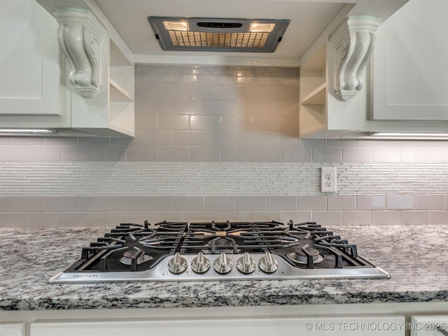 5815 E 144th St S, Bixby, OK 74008 - kitchen with open shelves, extractor fan, stainless steel gas cooktop, white cabinets, and decorative backsplash