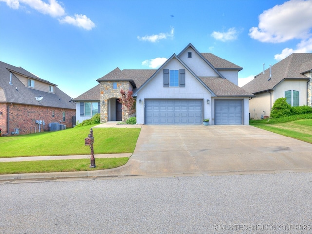 5815 E 144th St S, Bixby, OK 74008 - traditional-style home with stone siding, a front lawn, concrete driveway, roof with shingles, and stucco siding