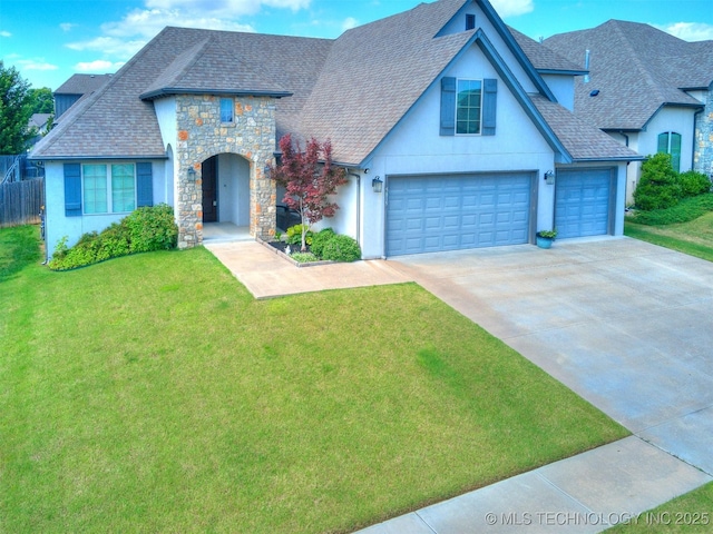 5815 E 144th St S, Bixby, OK 74008 - french country inspired facade featuring stucco siding, stone siding, concrete driveway, and a shingled roof