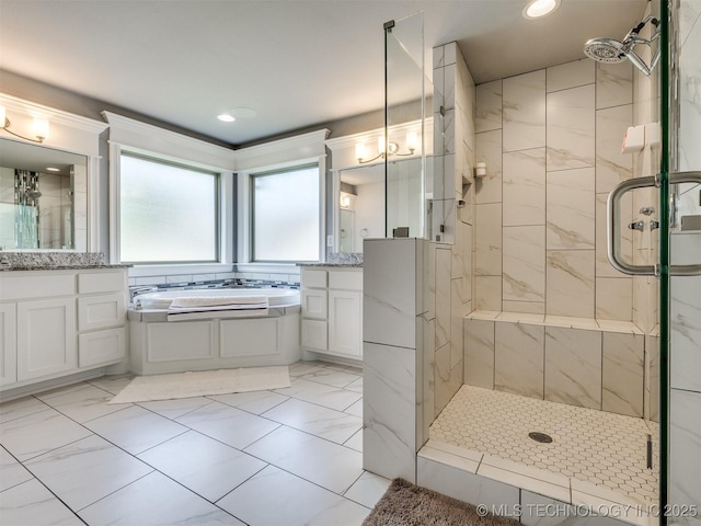 5815 E 144th St S, Bixby, OK 74008 - full bathroom with a shower stall, a garden tub, two vanities, marble look tile flooring, and recessed lighting