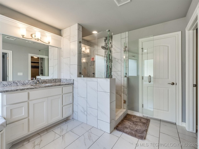 5815 E 144th St S, Bixby, OK 74008 - full bathroom with vanity, a shower stall, marble look tiles, and recessed lighting