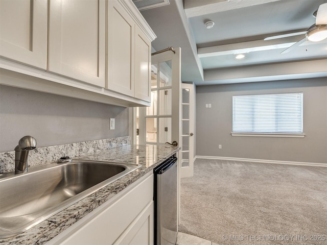 5815 E 144th St S, Bixby, OK 74008 - kitchen featuring dishwasher, light carpet, white cabinets, ceiling fan, and light stone countertops
