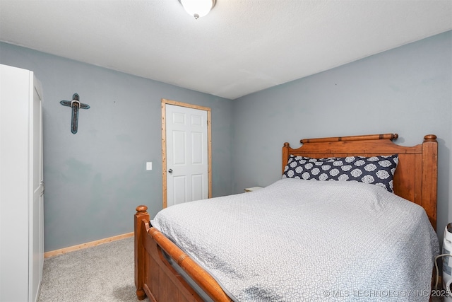 6607 Old Taft Rd, Muskogee, OK 74401 - bedroom with light carpet and baseboards