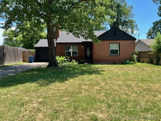 4111 S Owasso Ave, Tulsa, OK 74105 - ranch-style home with brick siding, asphalt driveway, a garage, and crawl space