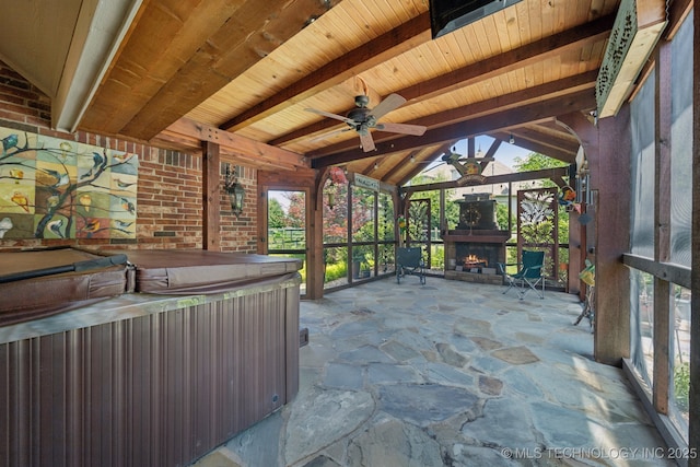 4205 N Narcissus Ave, Broken Arrow, OK 74012 - unfurnished sunroom with a warm lit fireplace, a ceiling fan, and a jacuzzi